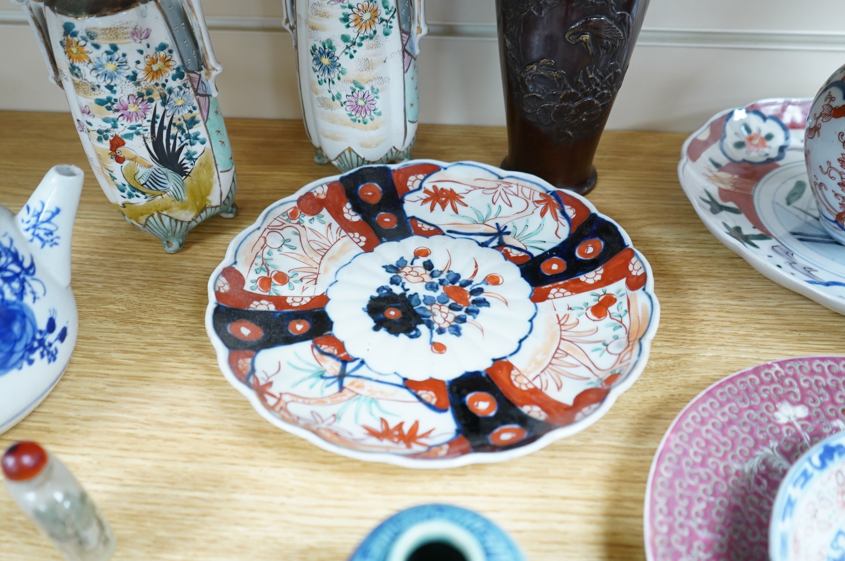 A collection of Asian ceramics to include an inside painted glass snuff bottle, pink ground dish and an Imari dish